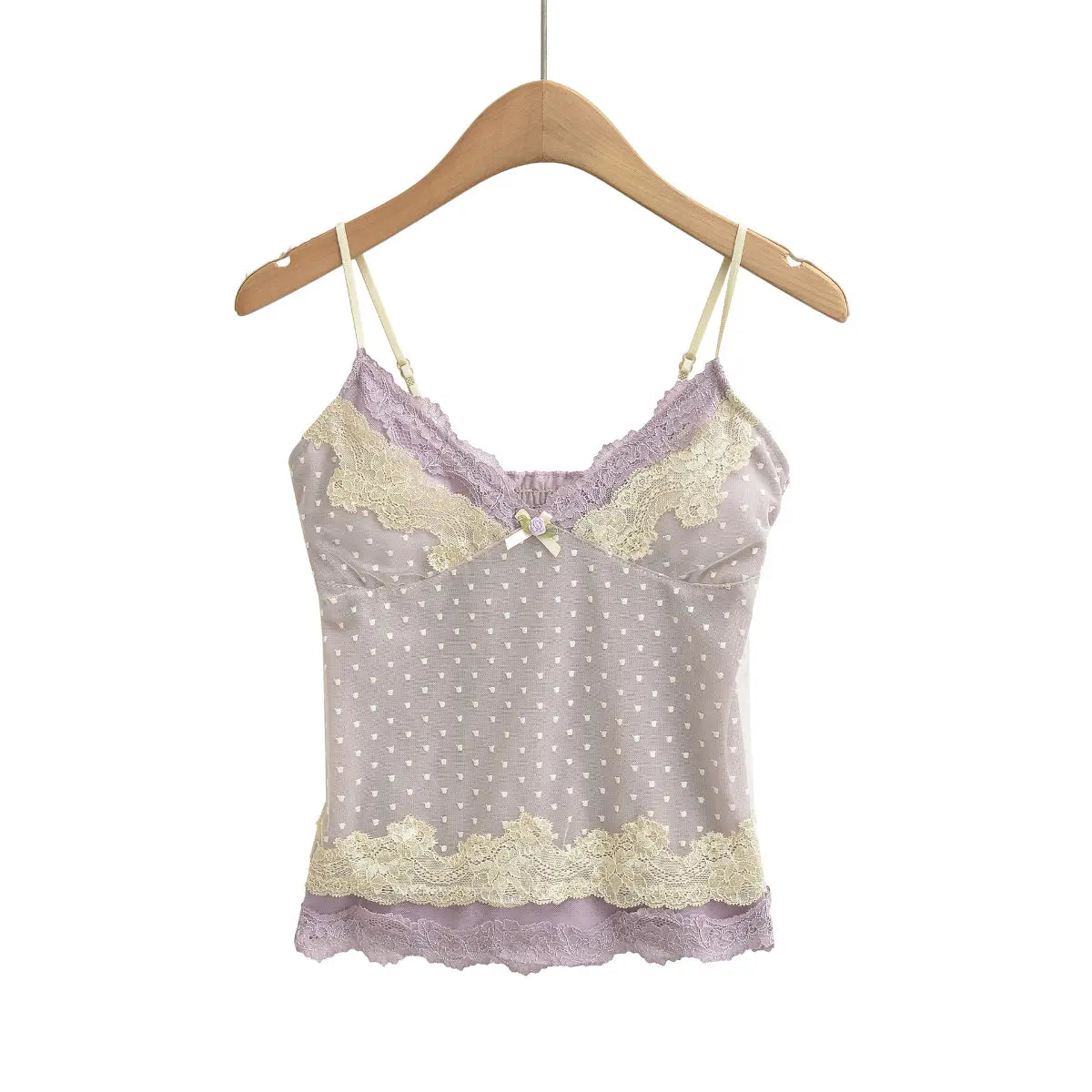 Studio shot of a lavender camisole with heart-patterned mesh, lace trim, and a small floral accent.