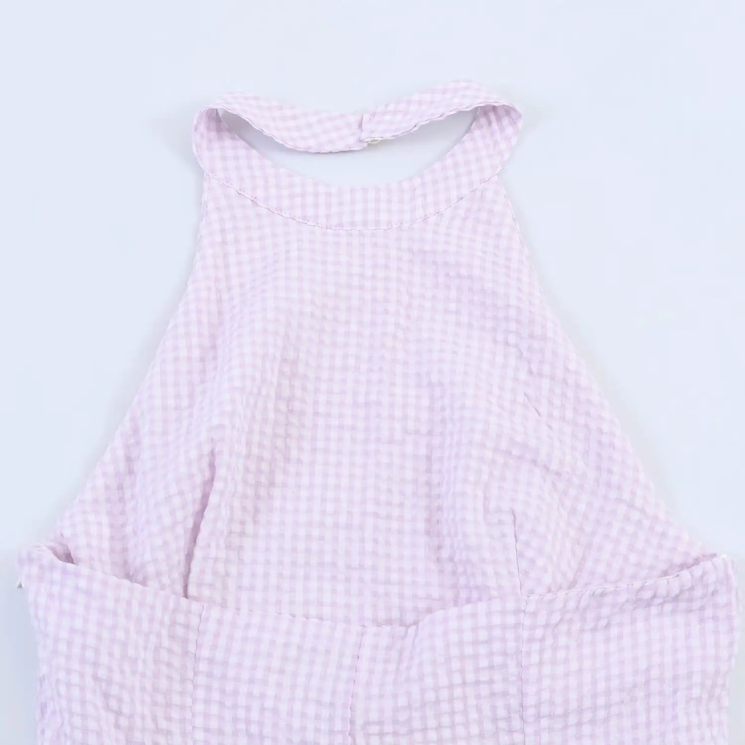 Close-up back view of halter neck, open back design, lavender gingham bodice and strap