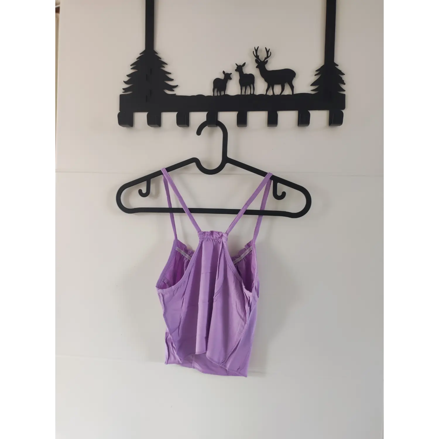 Full back hanging view lavender halter cami crop top showing open back construction
