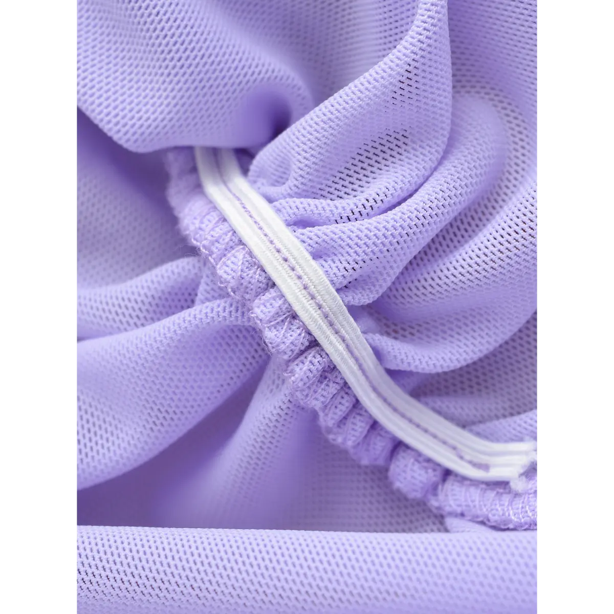 Close-up of the elasticated ruching channel on the lavender dress, showing stitching