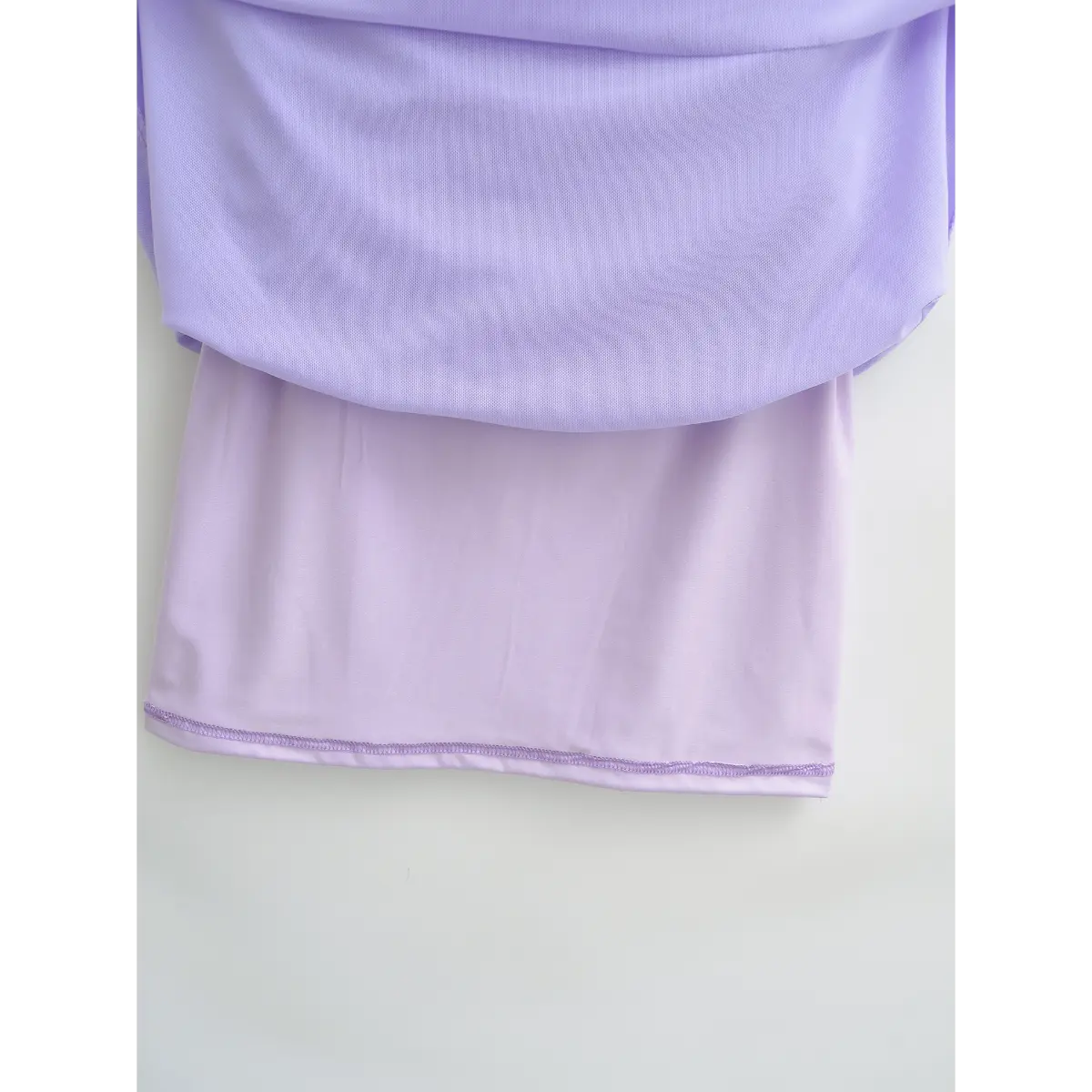 Close-up of the finished hemline on the lavender mesh dress