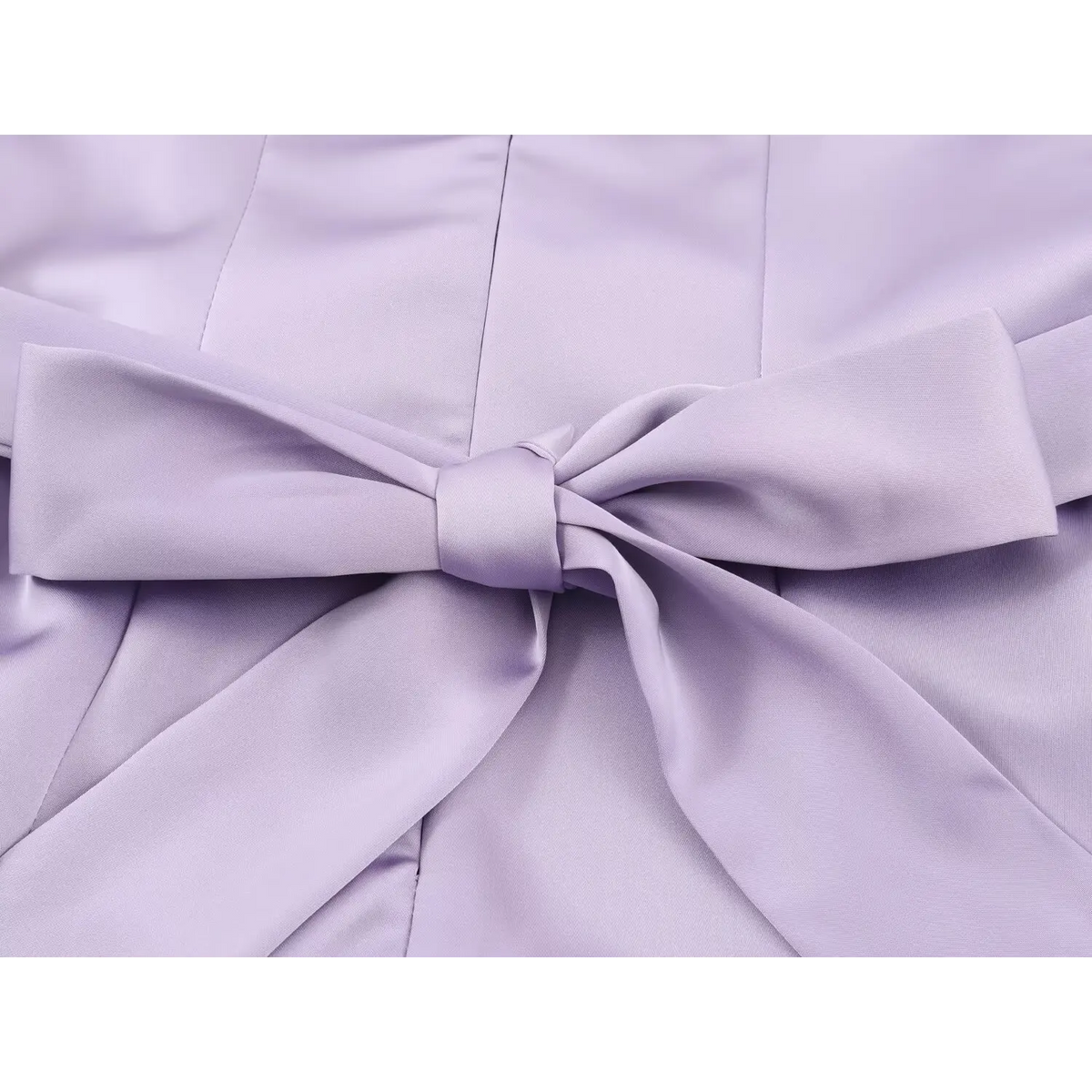 Close-up of self-fabric back tie bow