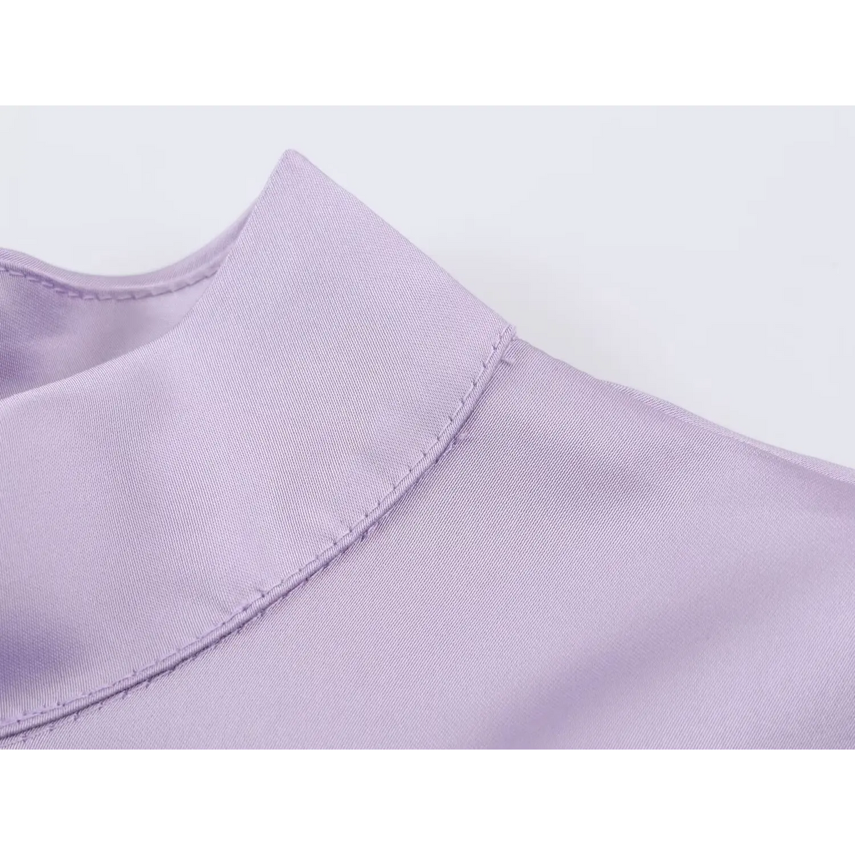 Close-up of mock neck stand and topstitching
