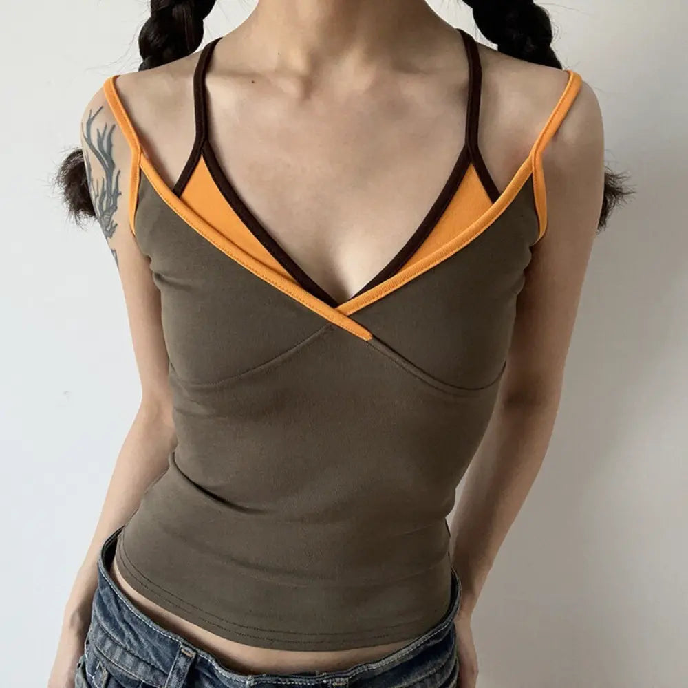 Lifestyle shot of model wearing the layered brown and orange V-neck camisole top
