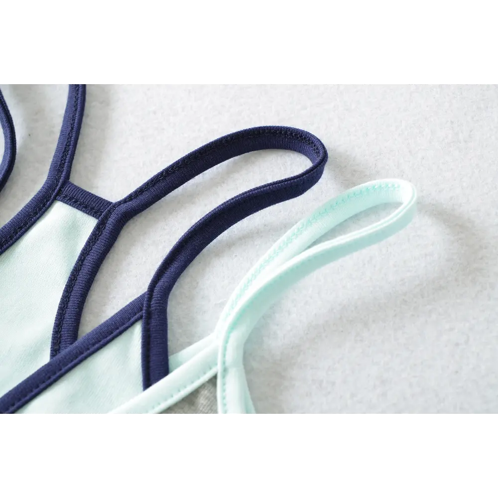 Close-up of the triple straps and color contrast on the gray and light blue camisole