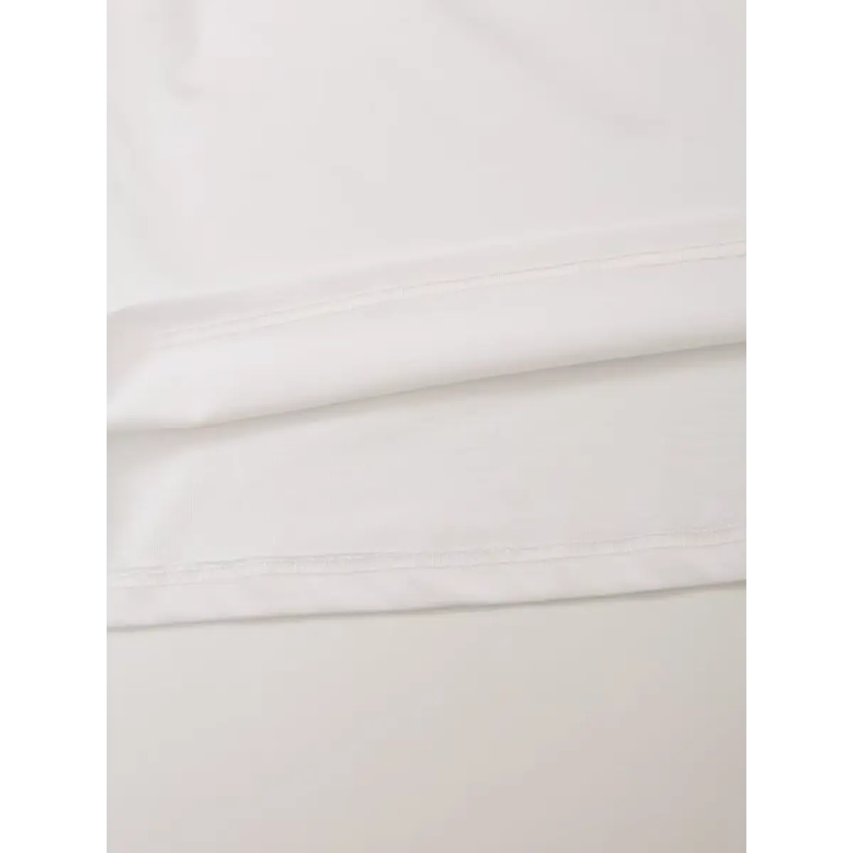 Macro view earring portrait box print left chest soft white cotton fabric