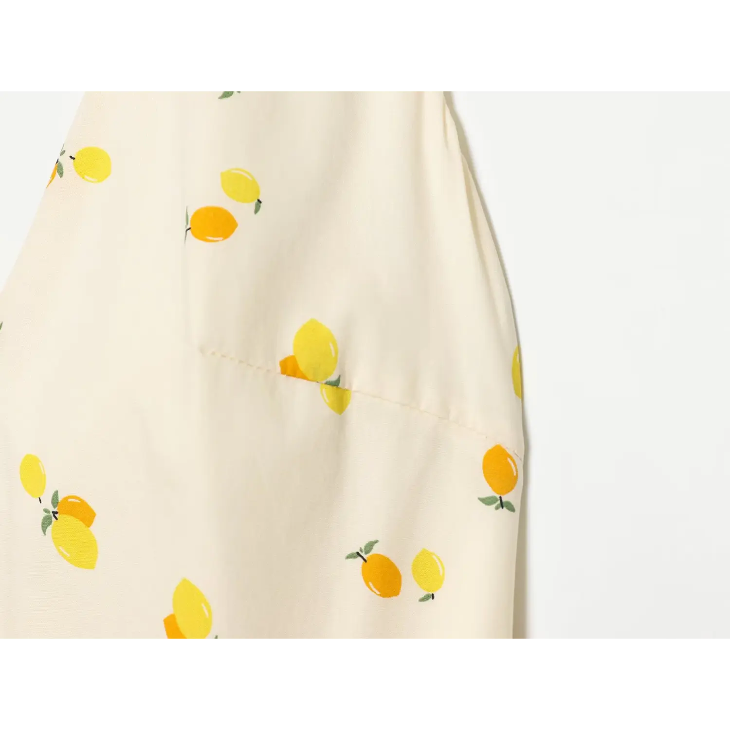 Close-up of side pocket seam and lemon print fabric