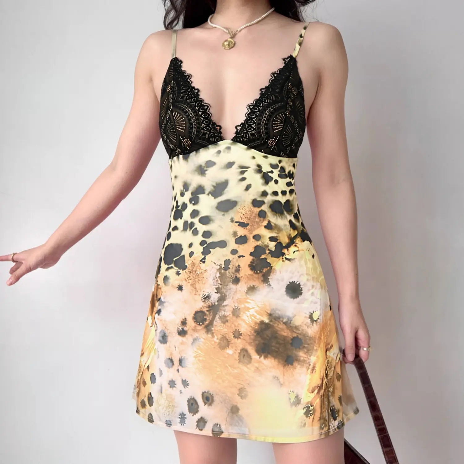 Women wearing sexy black eyelash lace deep v leopard print cami mini dress, model front shot