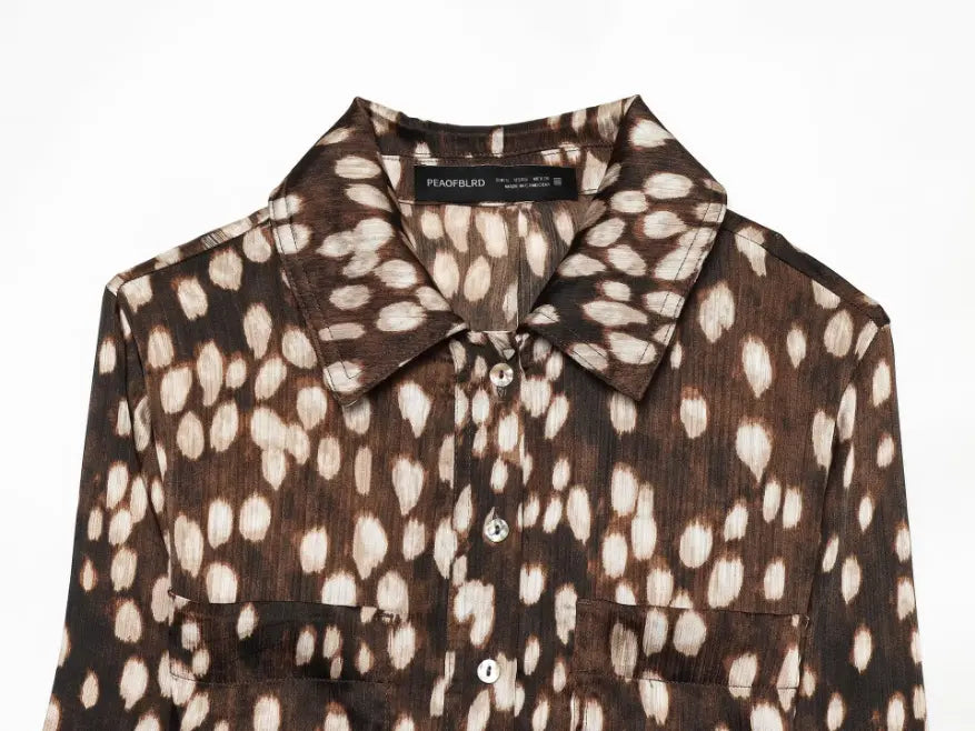 Close-up of collared neckline and button placket