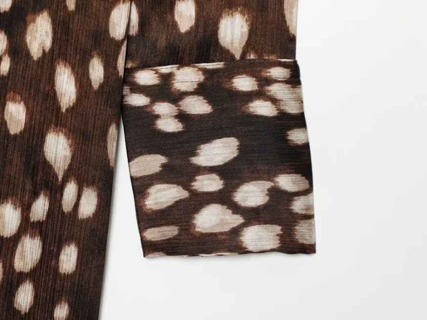Close-up of long sleeve cuff and leopard print