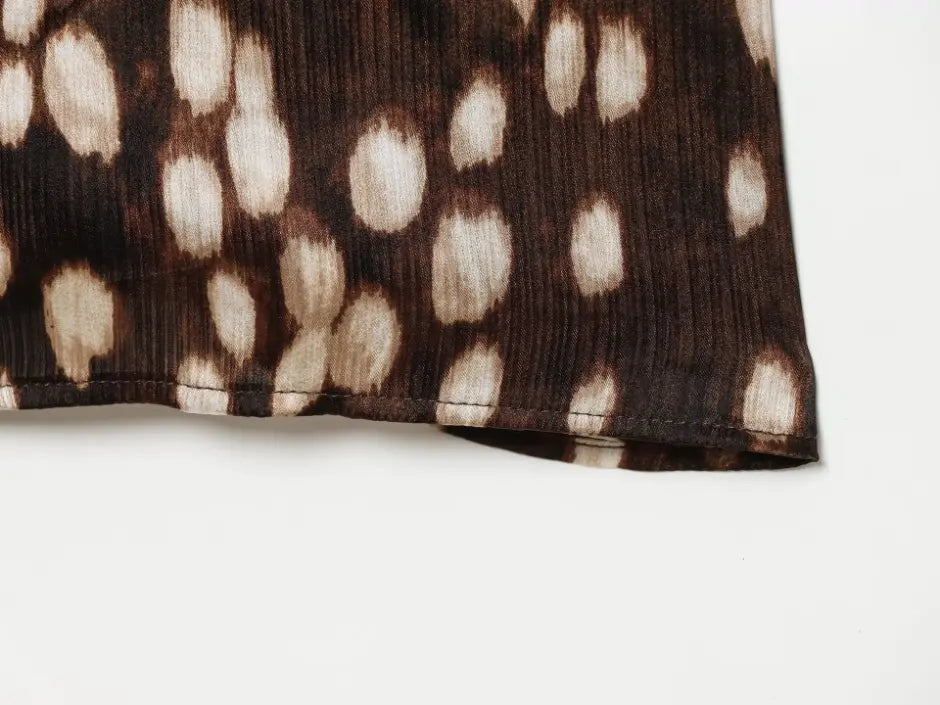 Macro close-up of hem stitching and leopard print