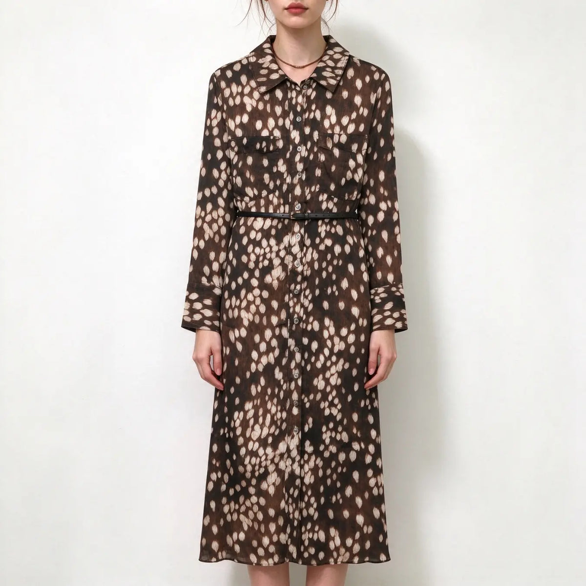 Model wearing leopard spot print collared belted midi shirt dress with black belt, front view