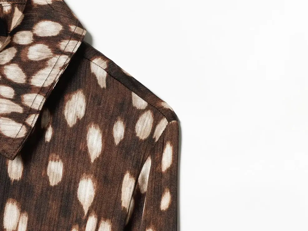 Close-up of shoulder seam and leopard print fabric