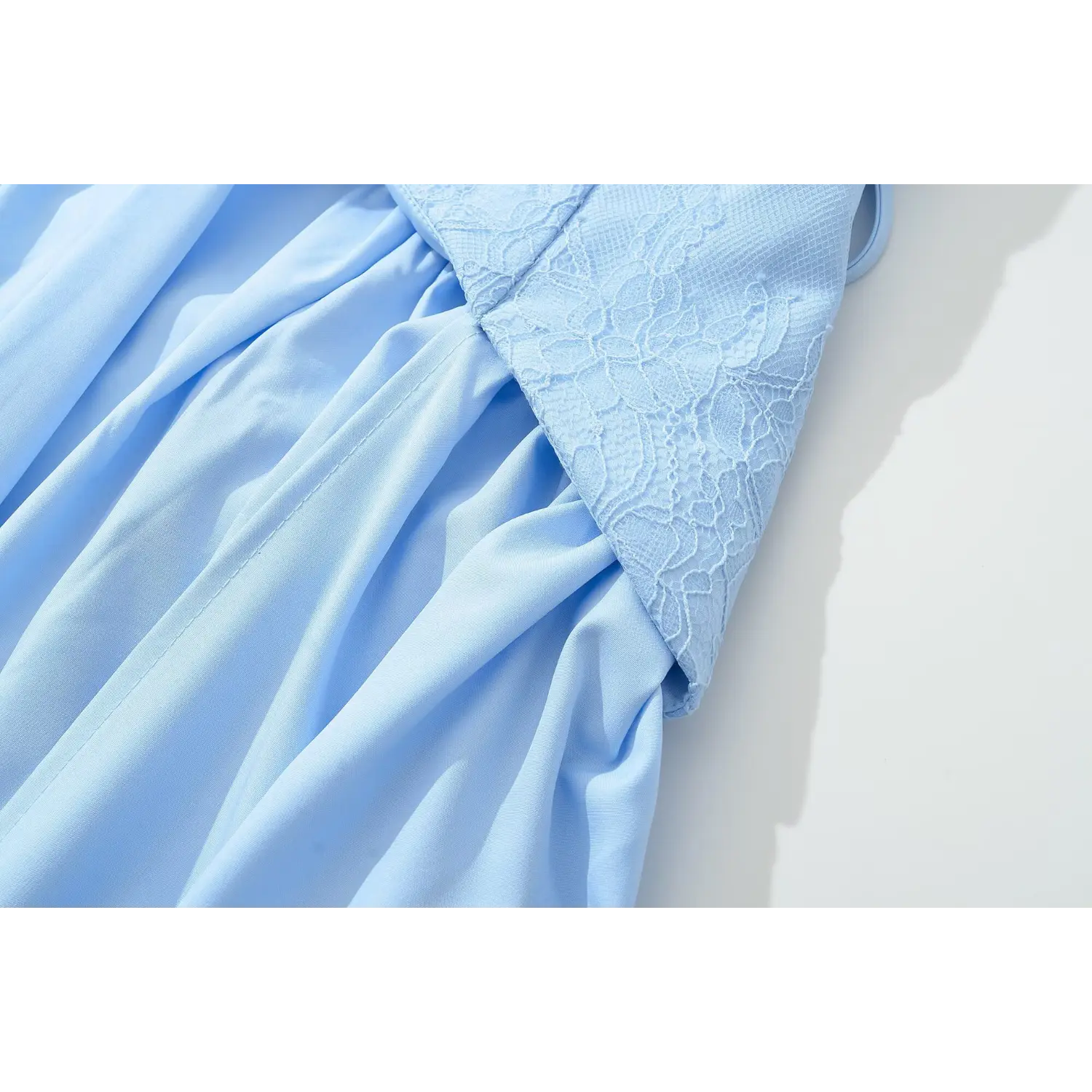 Close‑up waist seam and skirt gathering transition light blue lace corset maxi dress