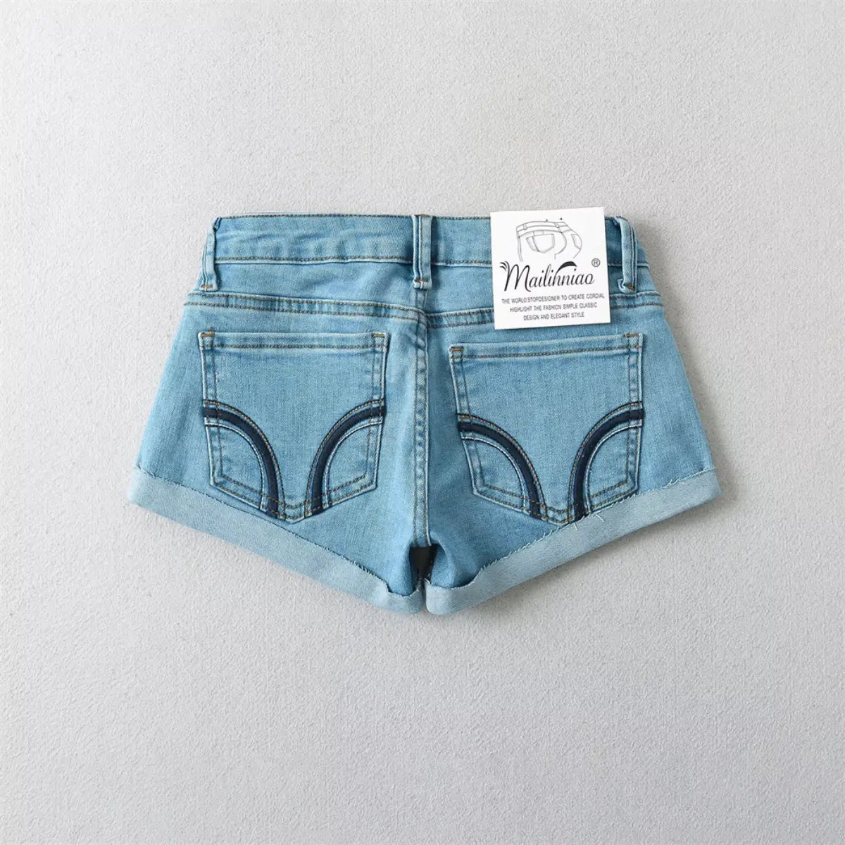 Back view of light blue low-rise denim shorts, showing the contrast stitching on the back pockets.