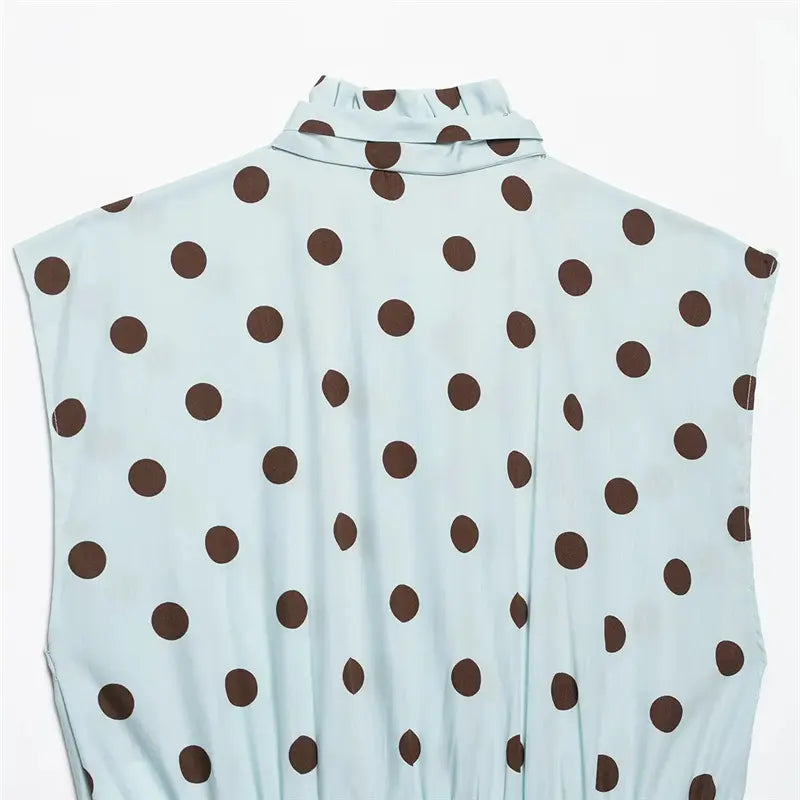 Upper back neck closeup, ruffled stand collar, allover brown polka dot lightweight fabric texture