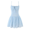 Front view of a light blue spaghetti strap dress with floral embroidery, lace trim, and keyhole tie detail.