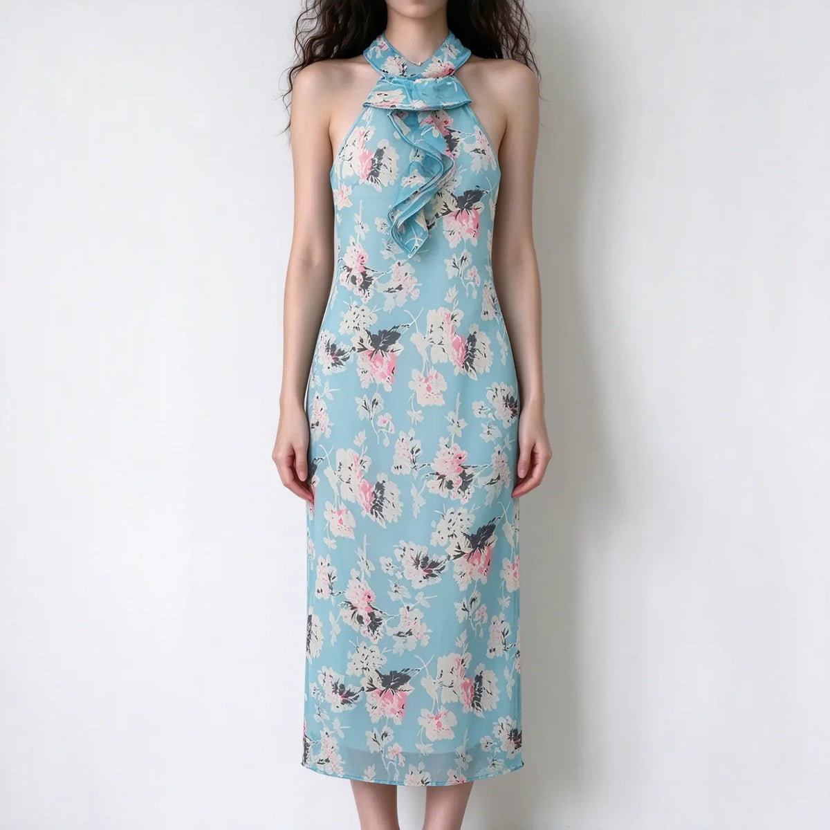 Model wearing light blue pink floral halter maxi dress with neck ruffle detail and slim fit silhouette, white background