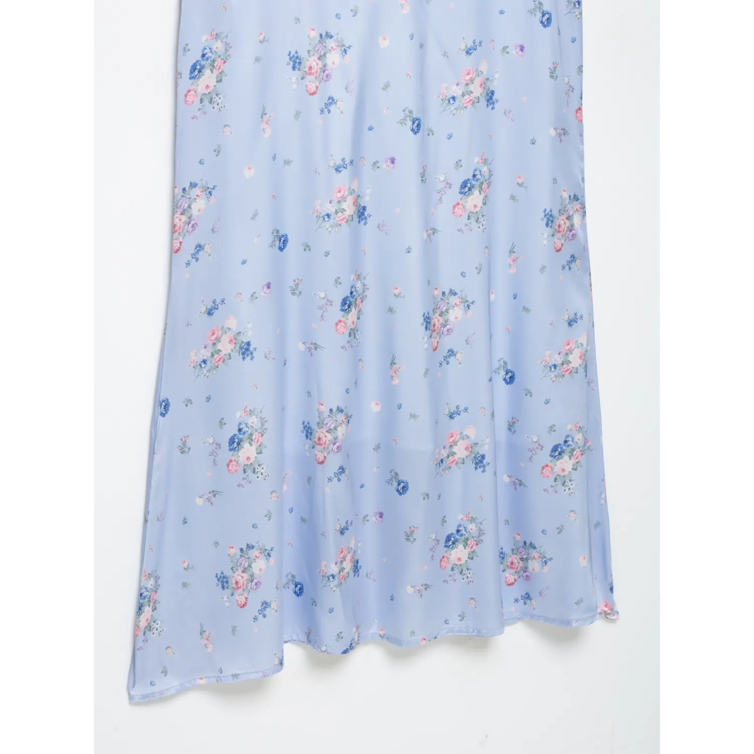 Close-up of flowing maxi skirt hem, light blue satin fabric, vintage mixed flower print