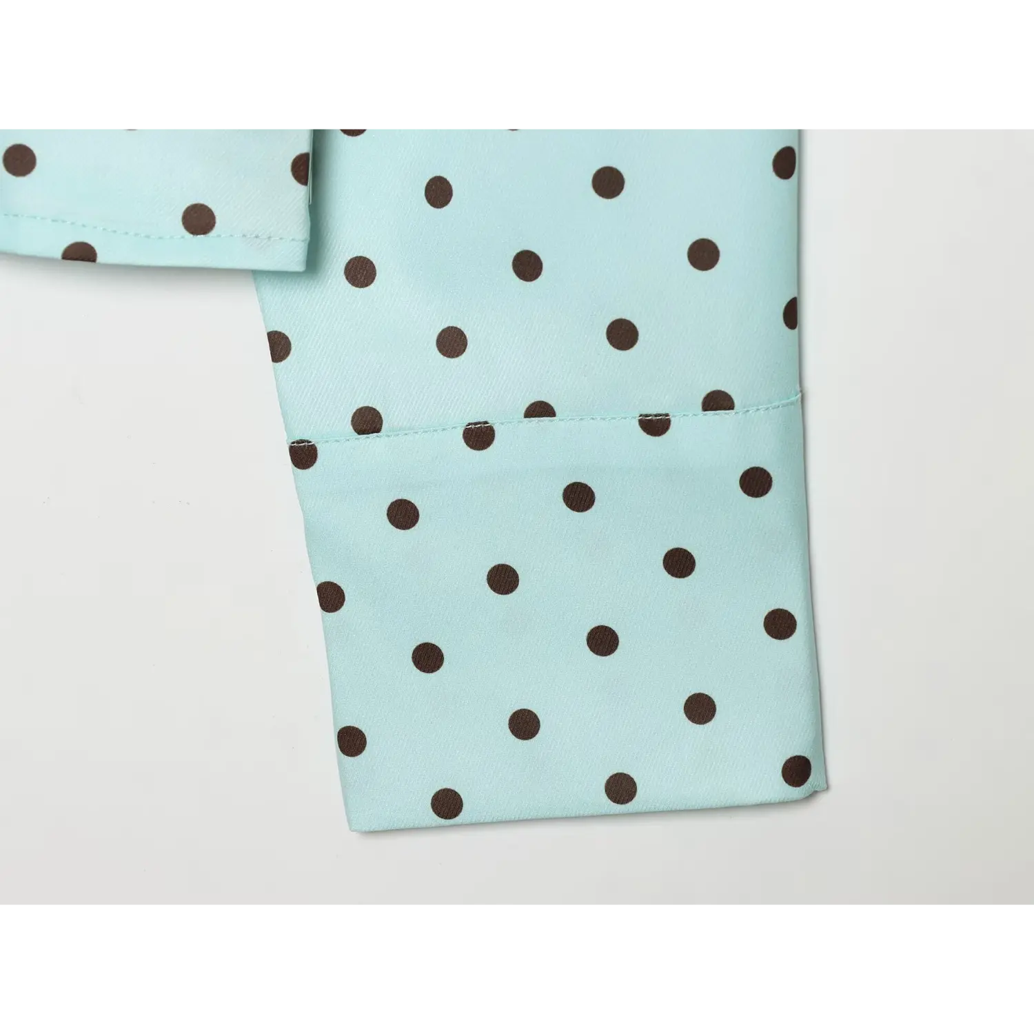 Side view plain long sleeve cuff, neatly folded finished edge stitching