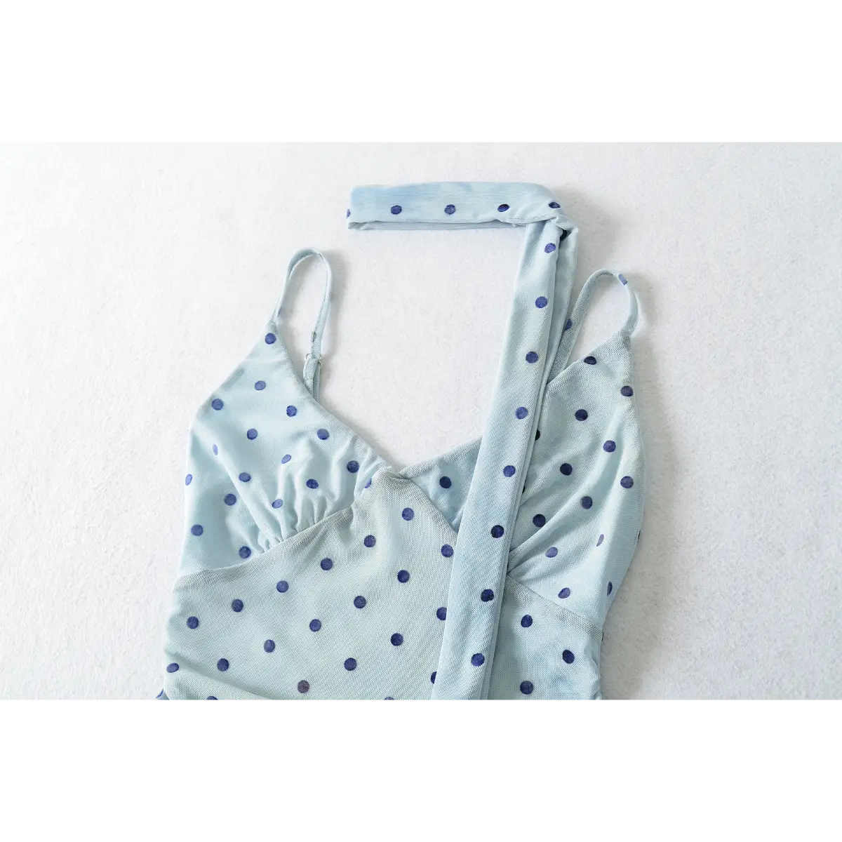 Full front view of the light blue mesh cami top with navy polka dots, including the matching long scarf tie.