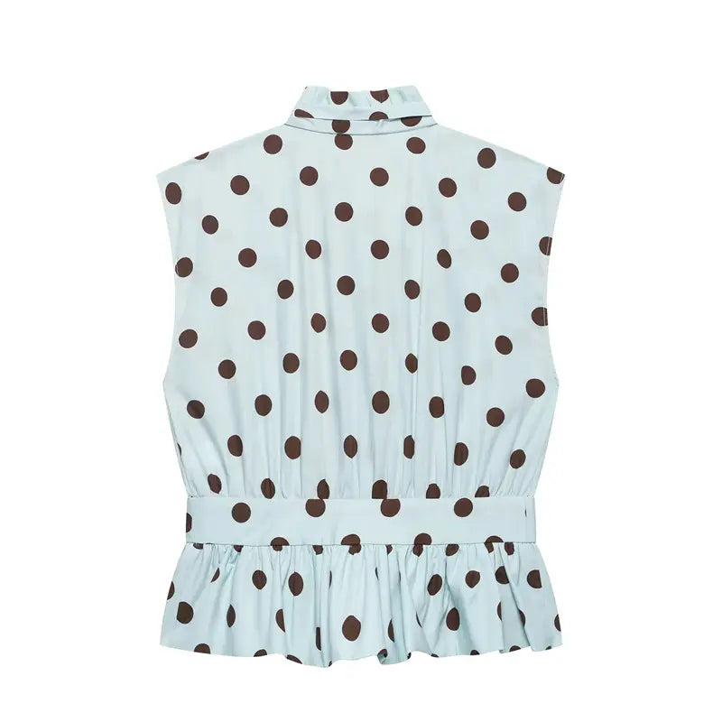 Back flat lay light blue dot sleeveless shirt, high ruffle neck, elastic smocked waistband, peplum frill hem
