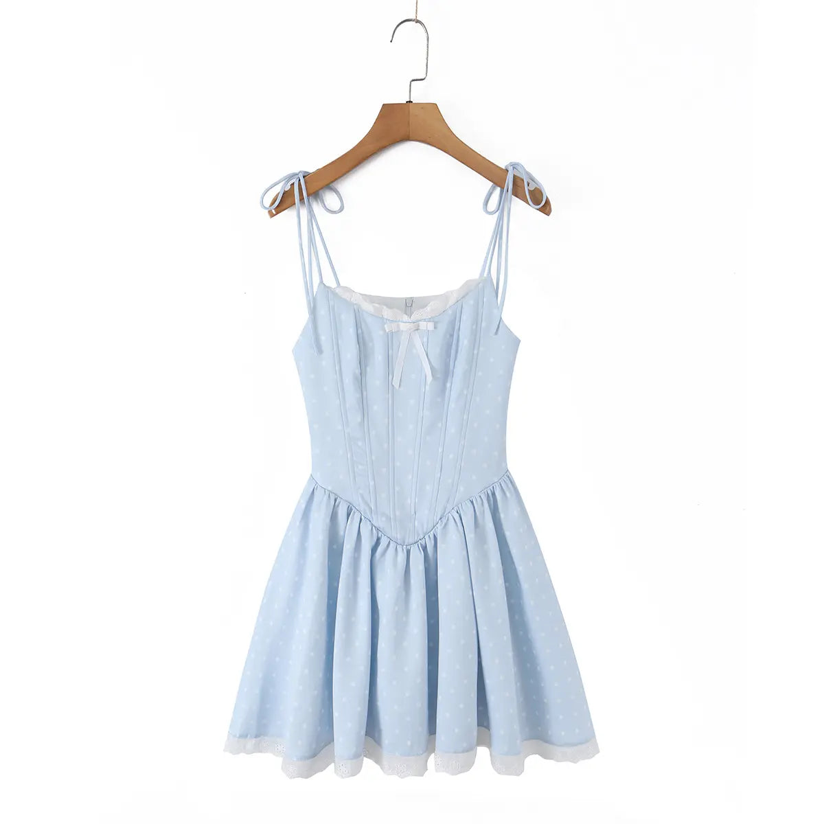 Front view of a light blue polka dot corset-style dress hanging on a wooden hanger.