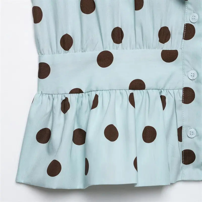 Front vertical button placket closeup, round white matching buttons, gathered bust smocking