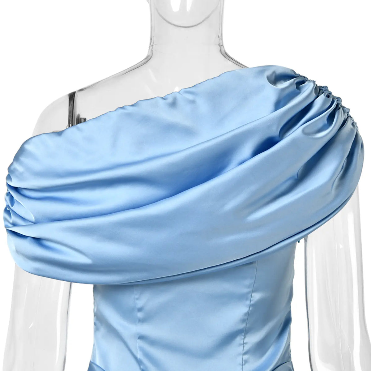 Extreme close‑up of draped gathered shoulder fabric detail light blue satin dress