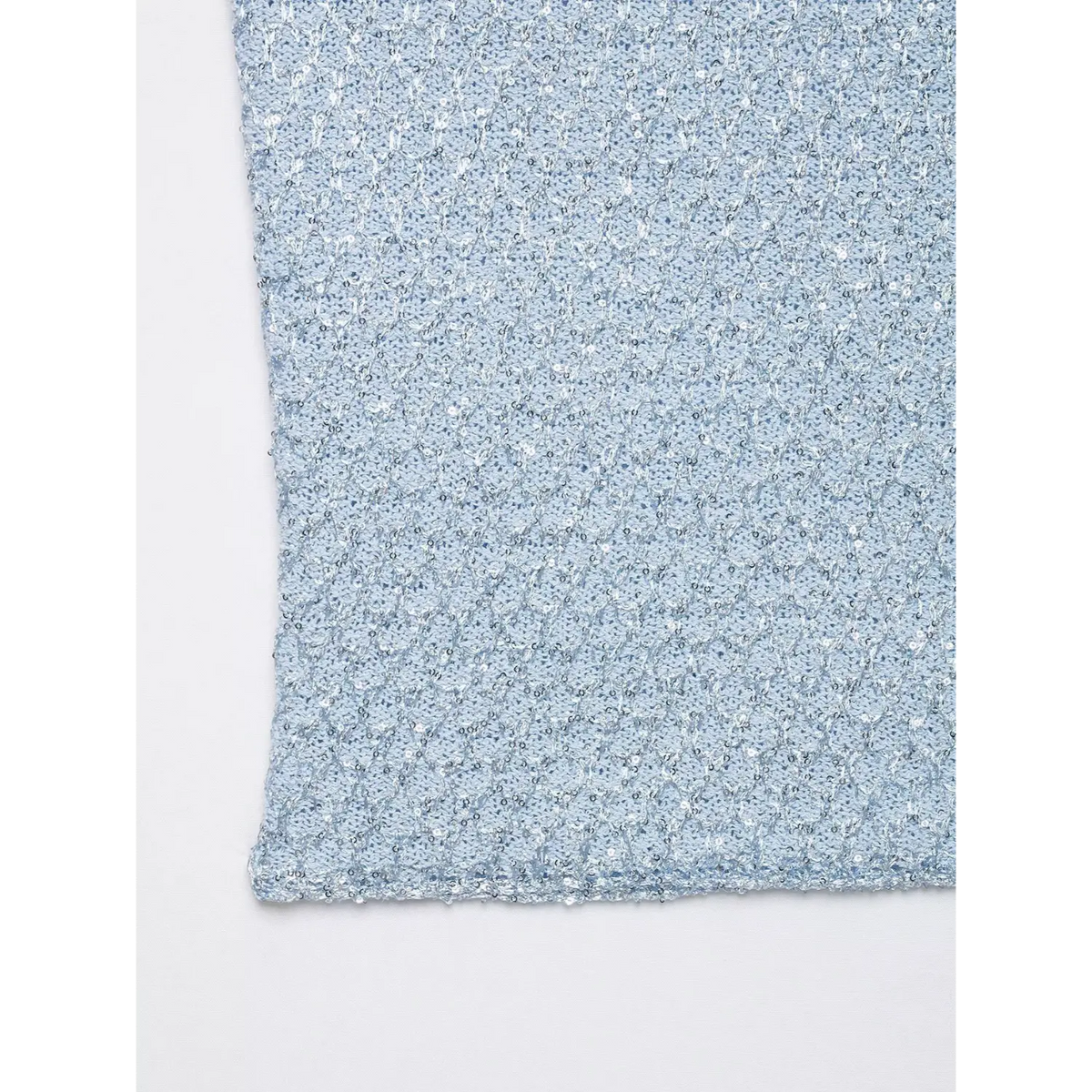 Close-up of hem and sequin knit fabric