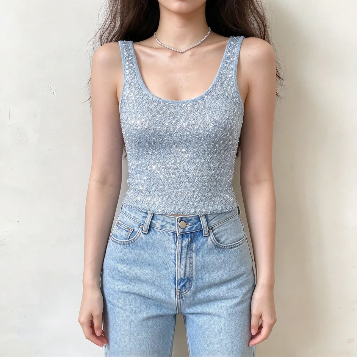 Model wearing light blue sequin knit tank top, front view