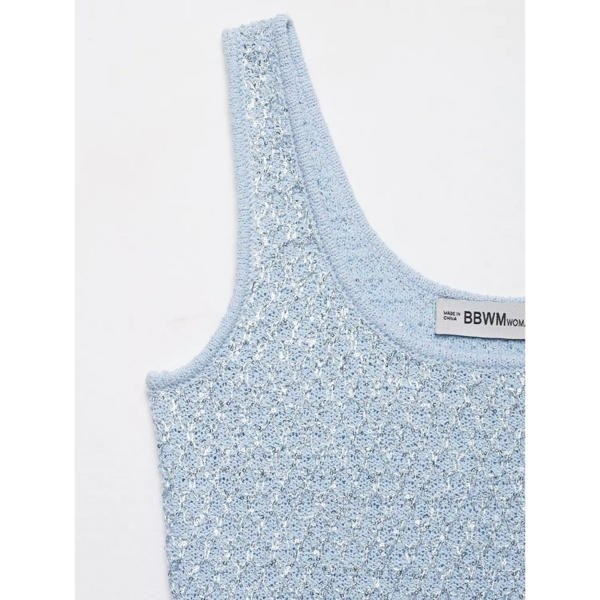 Close-up of shoulder strap and neckline label