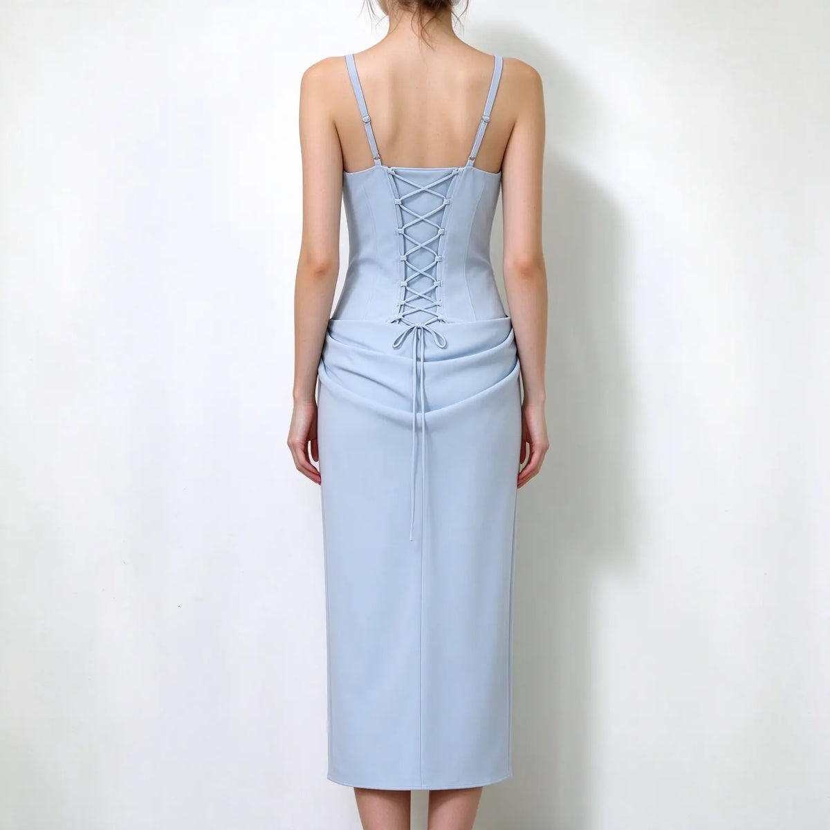 Model back view, light blue spaghetti strap maxi dress, lace-up corset back with adjustable ties, draped waist maxi skirt