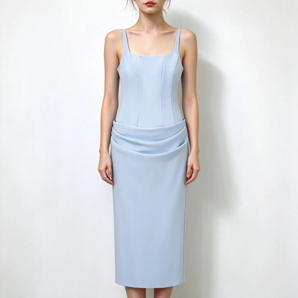 Model front view, light blue square neck spaghetti strap maxi dress, corset seamed bodice, draped folded waist skirt, sleek formal maxi dress