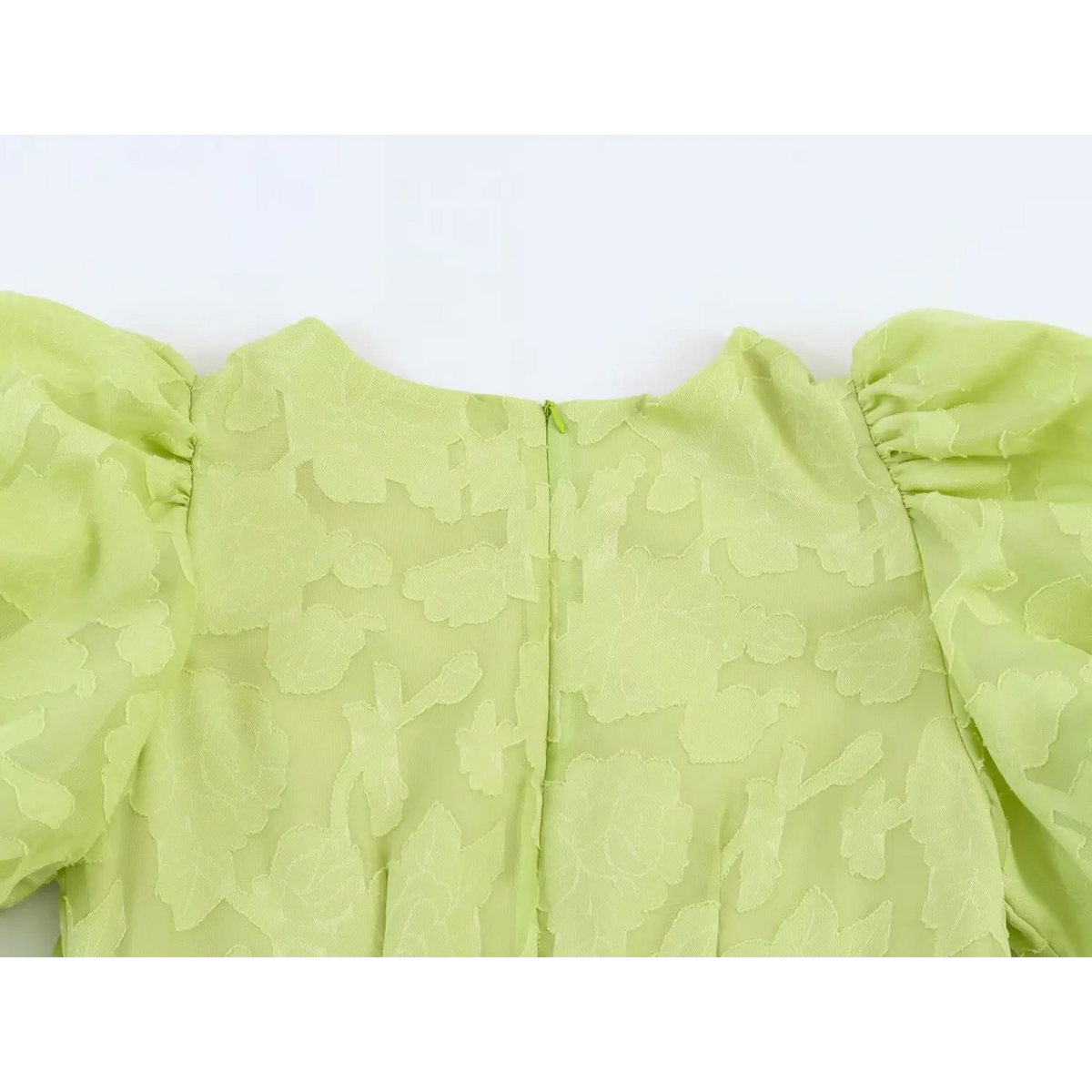 Back top view of light green jacquard maxi dress, puff sleeves and invisible center back zipper