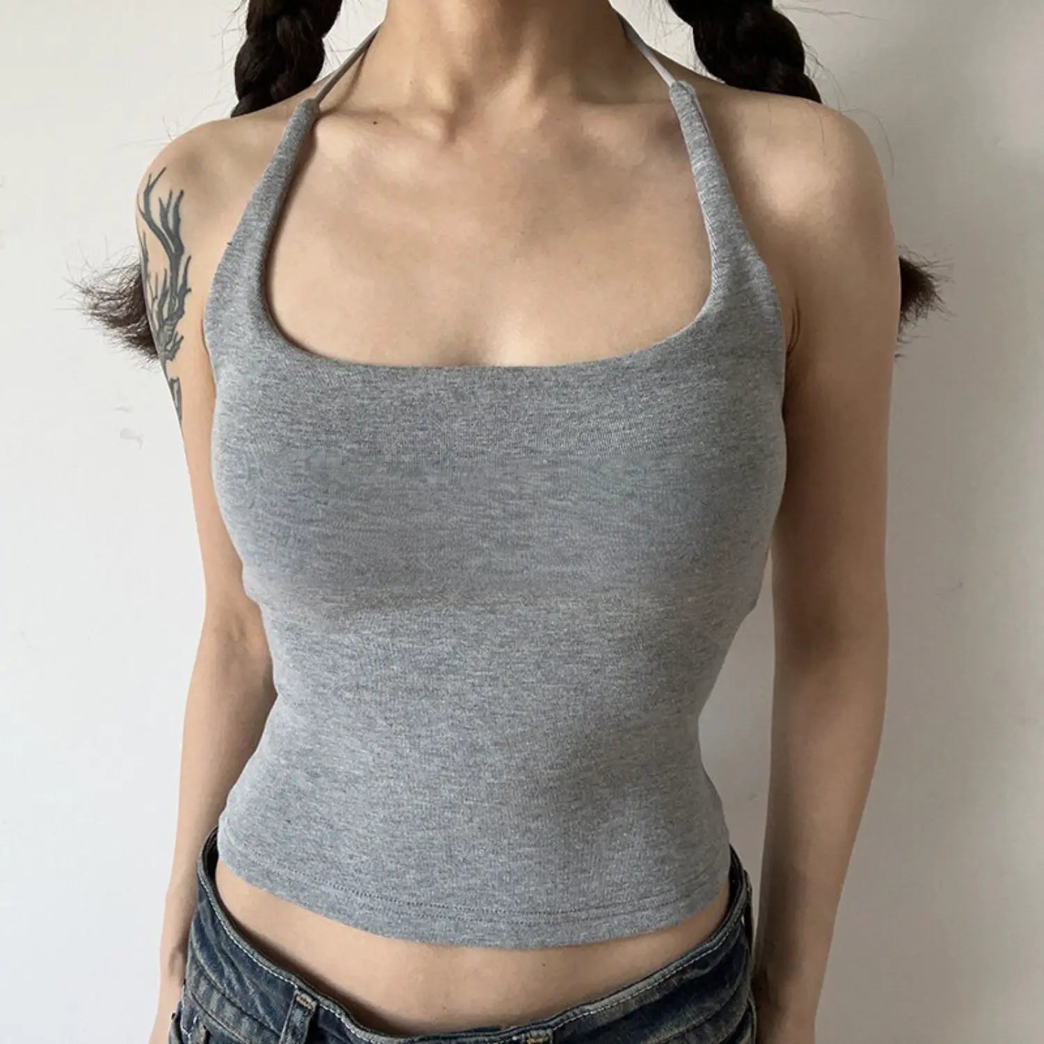 Light heather gray solid halter knit tank model shot, high stretch knit fabric minimalist square halter neck slim fit basic y2k top shot
