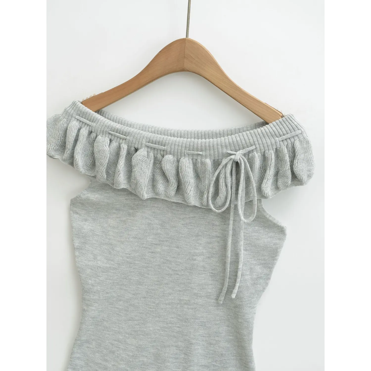 Light heather gray ruffle off shoulder knit tube top front hanger white background shot, vertical stretch rib folded flounce neck adjustable front drawstring slim waist sleeveless knit top detail shot
