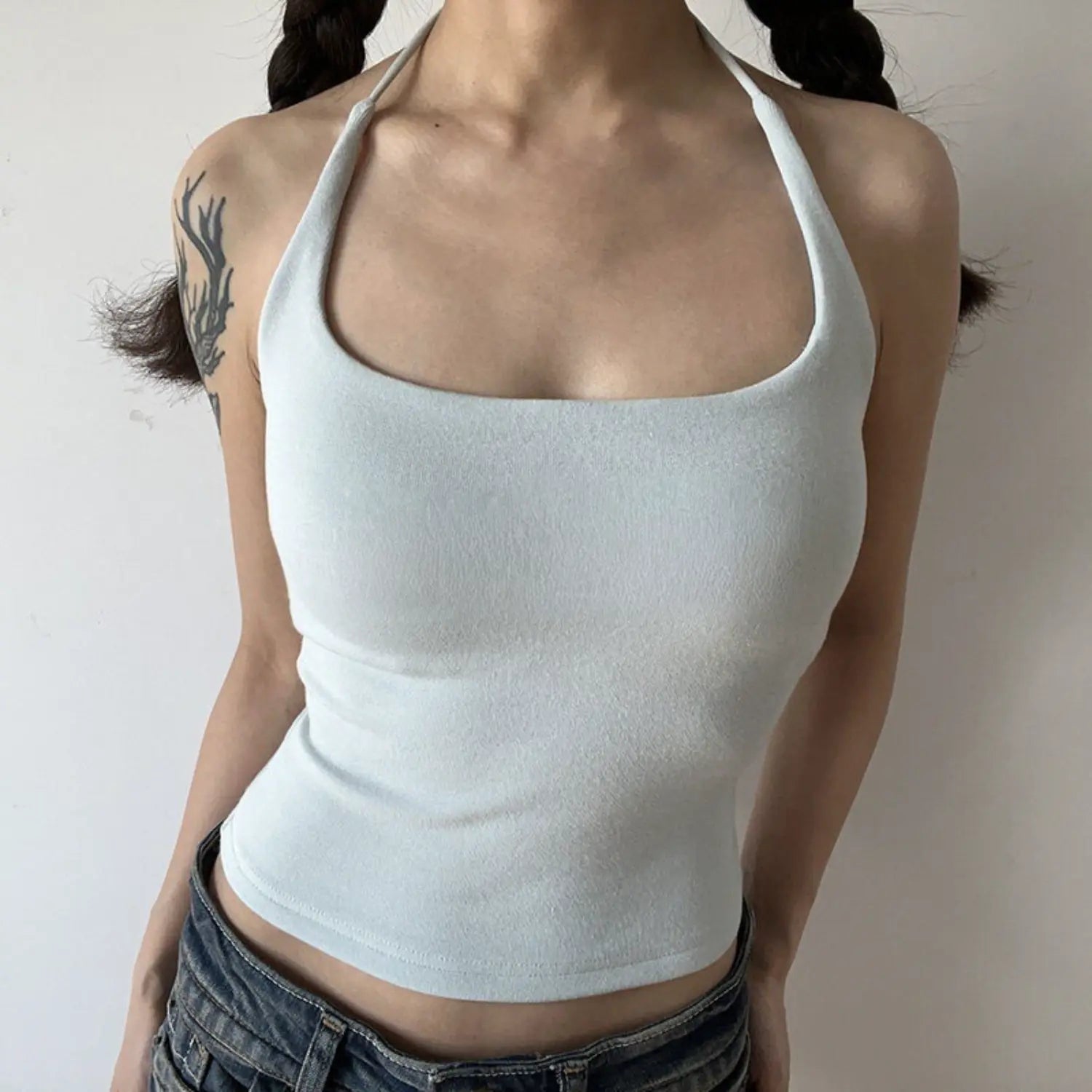 Light ice blue solid halter knit tank model shot, fresh light color soft knit wide square halter waist shaping spring summer cool layering top shot