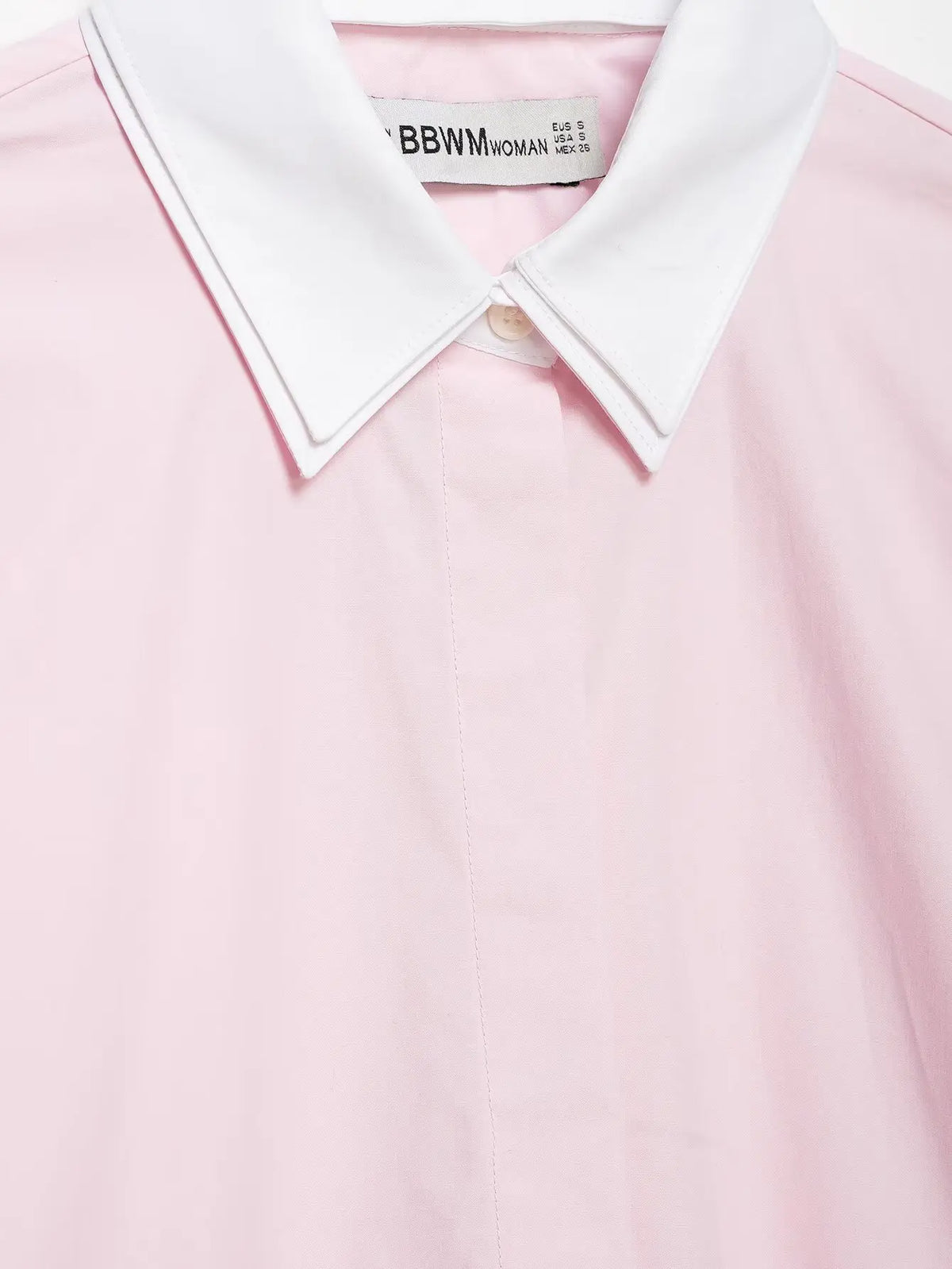 Macro close-up of collar button and hidden placket