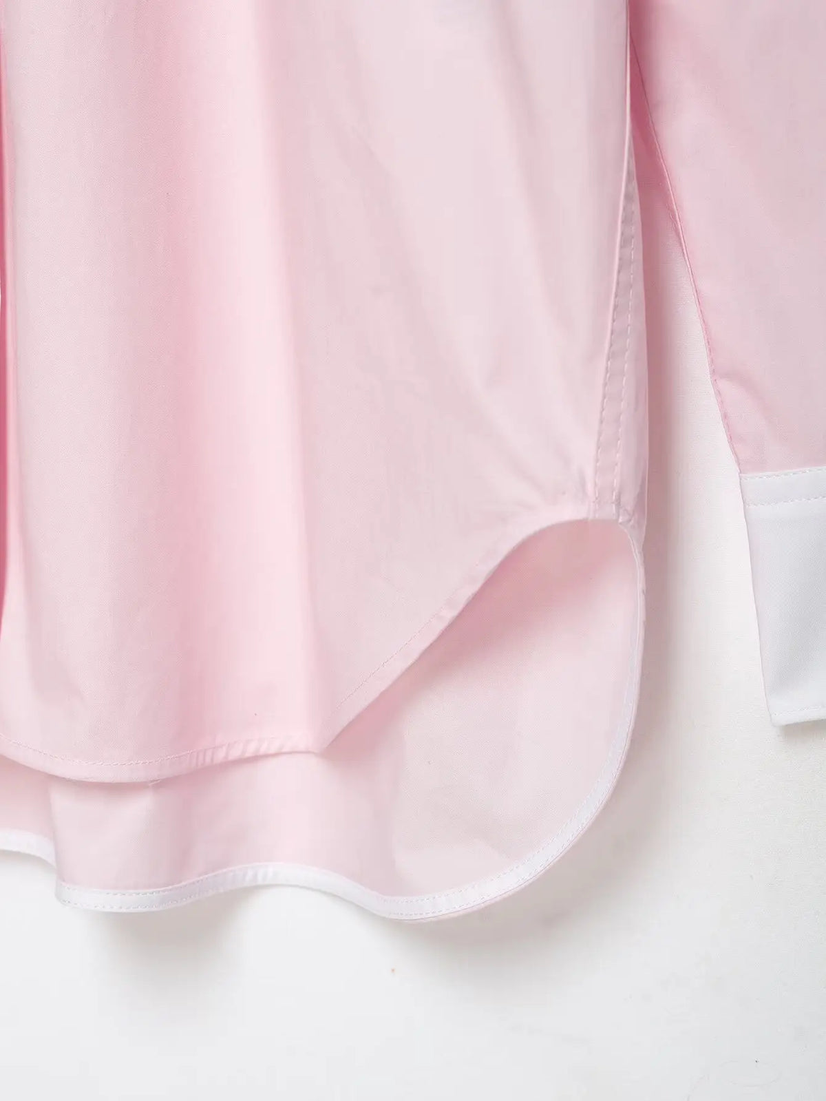 Close-up of side seam and curved hem
