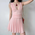 Light pink deep V neck sleeveless mini dress, waist ruched design, flared skater skirt, women casual party short dress | Front view worn on model
