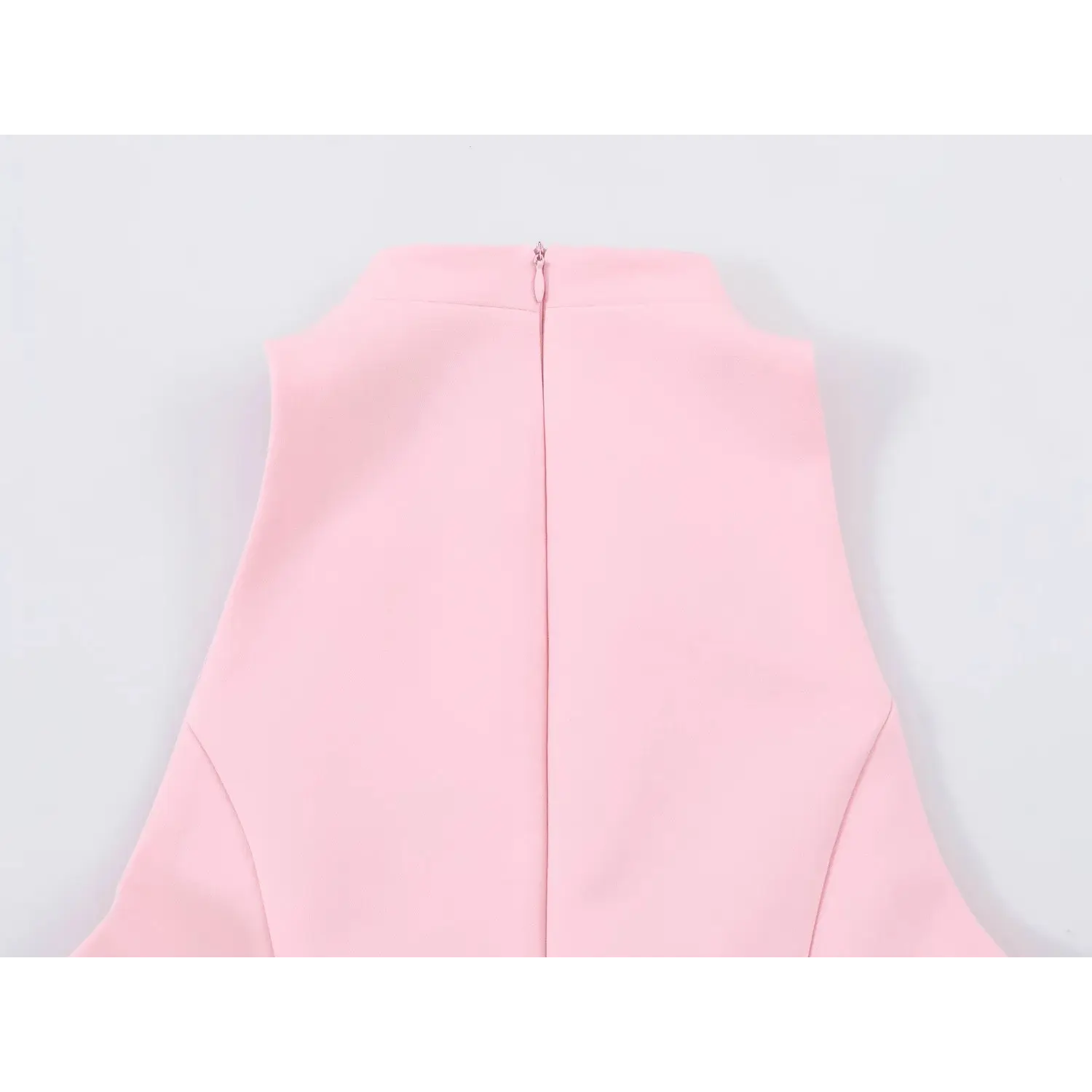 Back stand collar & invisible zipper macro shot, matching pink zipper teeth, seamless back neck knit binding