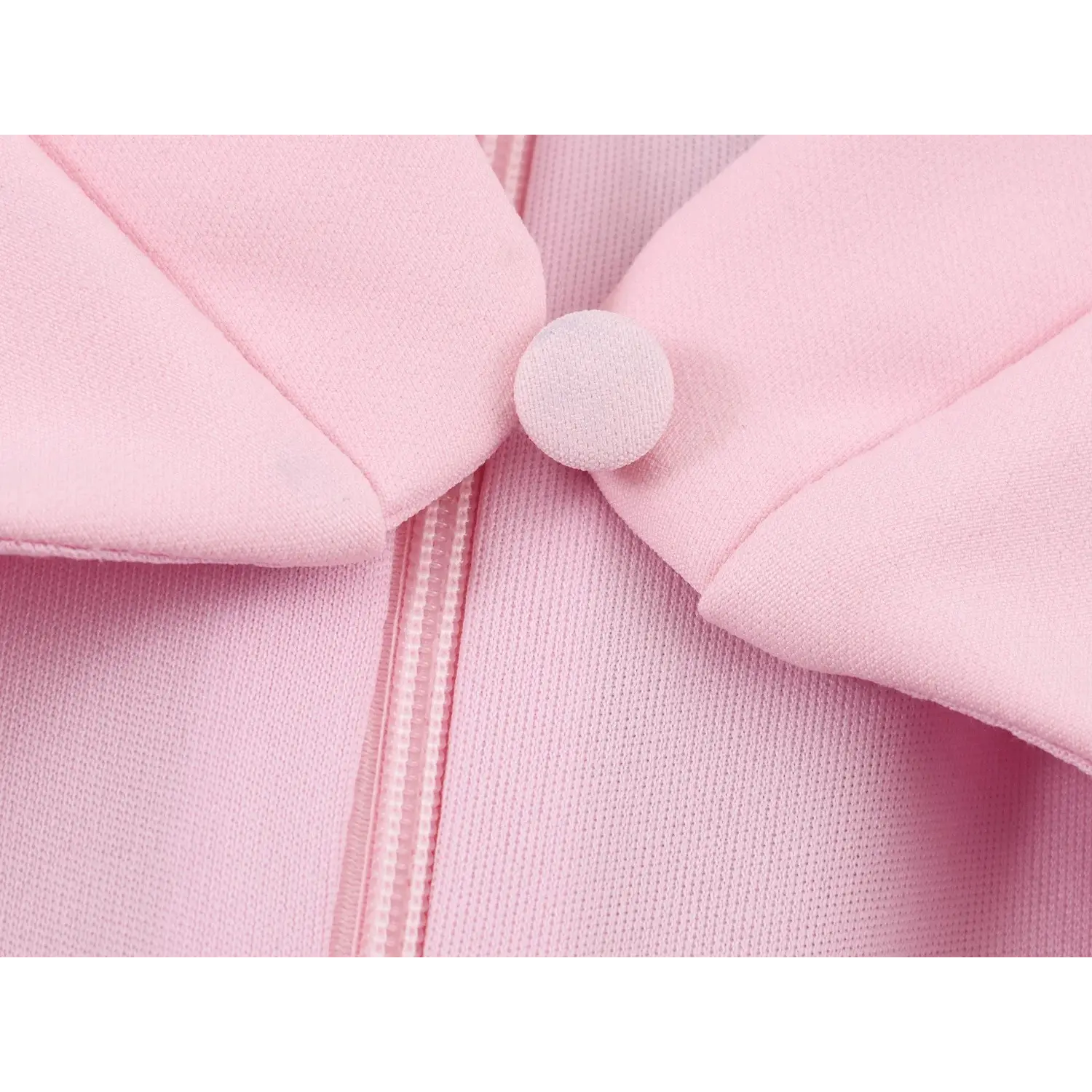 Front stand collar round covered button extreme close-up, matching pink fabric wrap, folded collar placket seam