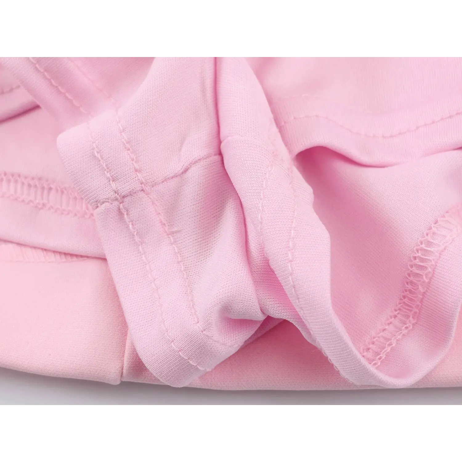 Inner lining fabric stitching close-up, overlock neat seam finish, soft matching pink lining material