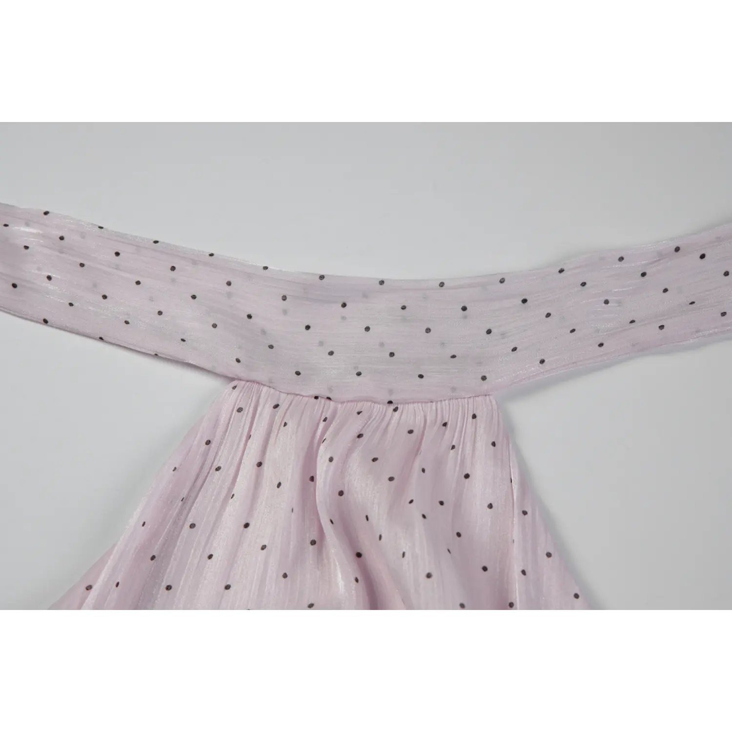 Close up of neck tie fabric, light pink polka dot shimmer chiffon