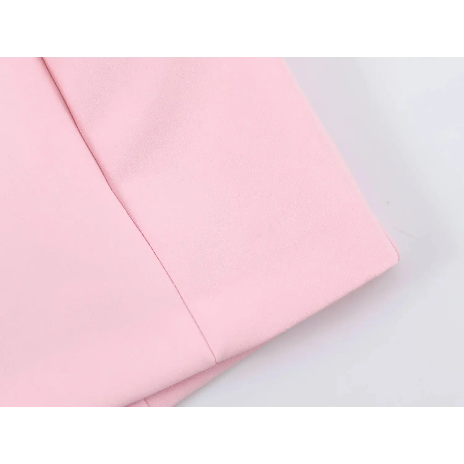 Side waist panel fabric close-up, smooth matte stretch woven texture, vertical tailored shaping seam