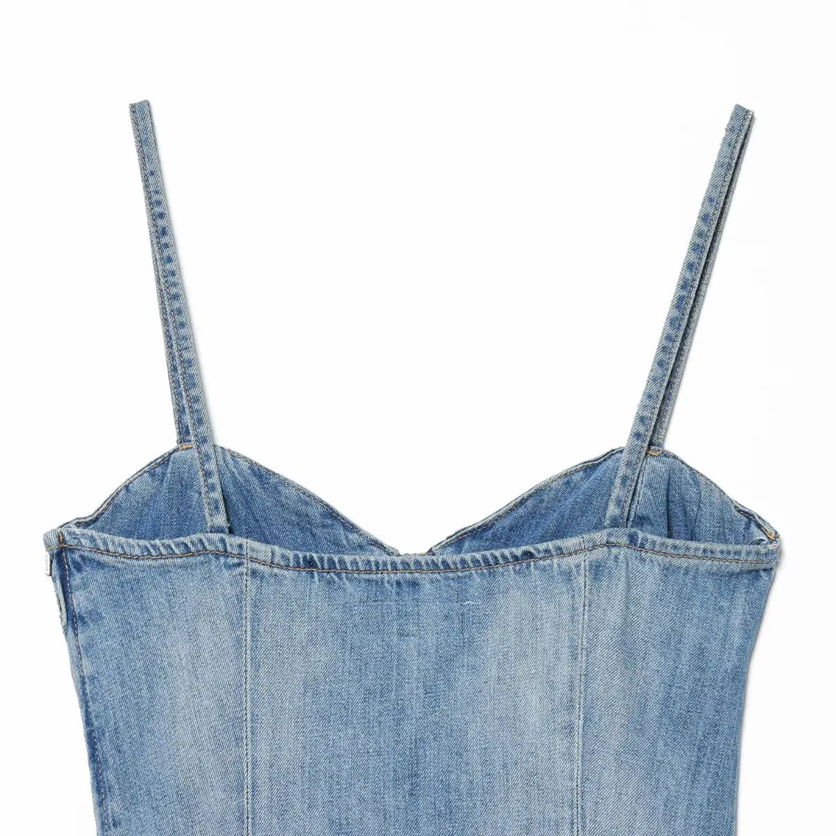 Back view of light wash denim spaghetti strap dress, showing the bustier construction and spaghetti straps