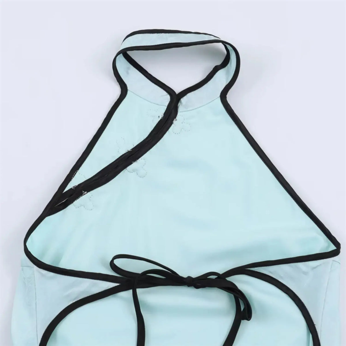 Close‑up of halter neck back tie detail