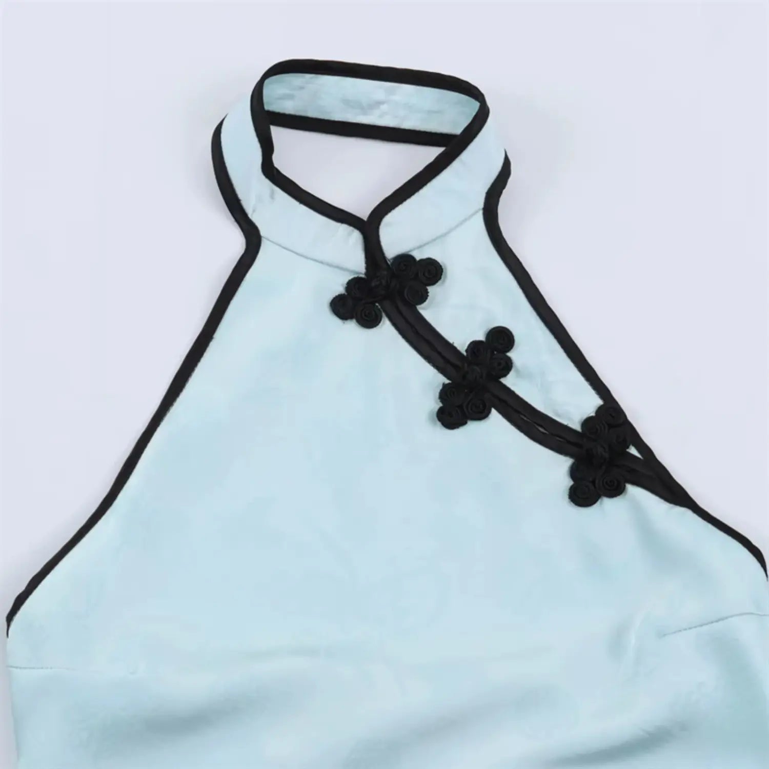Close‑up of front halter stand collar and black frog buttons