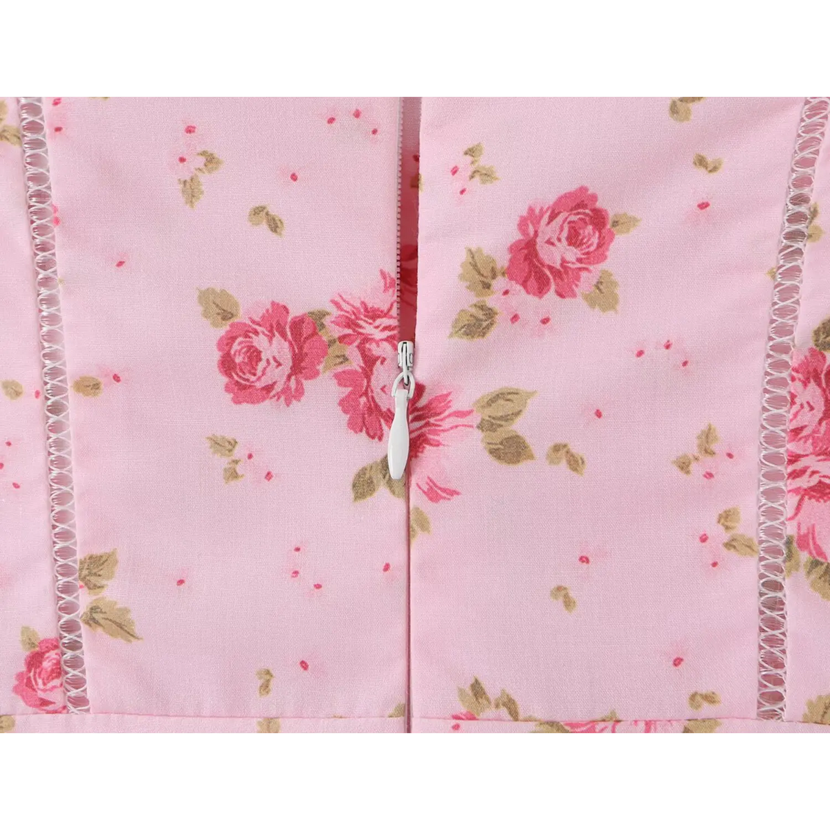 Close‑up of back zipper on light pink floral cami maxi dress